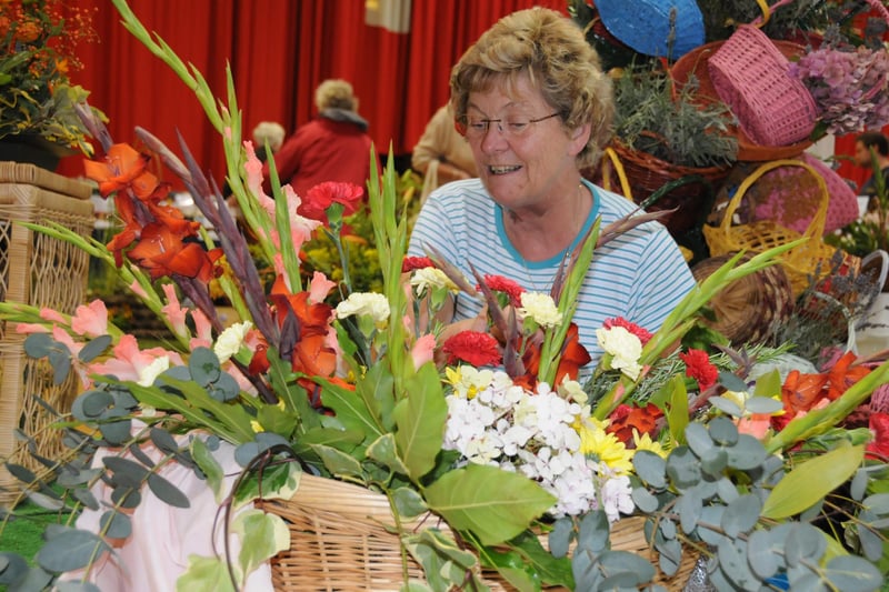 Pam Jameson puts the finishing touches to the display stand of Sunderland Floral Art Club at Sunderland Horticultural Show in 2010.