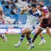 Caleb Hamlin-Uele is tackled by Leroy Cudjoe during Wakefield Trinity's win at Huddersfield Ginats last week. Picture by Alex Whitehead/SWpix.com.