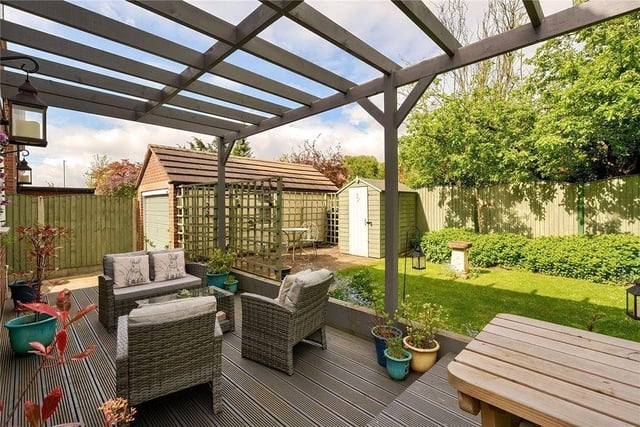 The corner plot allows for a much bigger garden than usual plus there is a lovely decking seating space with wooden pergola.