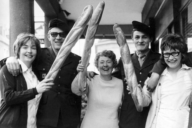 Members of the Evening Post Women's Circle defend themselves with long loaves from friendly "attack" by French soldiers during a four day trip to Paris in May 1971. This picture was taken at Beauvais as the party was en route home. Pictured, from left, are Pat Dawson, Joyce James and Marjorie Baines.
