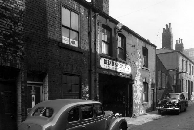 Garage premises and motor repair shop, 'Eyebrow Garage' on Upper North Street. This is the yard entrance, over the door is the name A. Pinder. Pictured in August 1959.