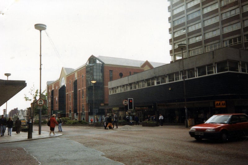 The Headrow from the junction with Albion Street, taken in the spring of 1991. On the right is Cavendish House, with the Automobile Association and Whitegates estate agents, among others, occupying the ground floor. To the left of this, after the junction with King Charles Street, is the Schofields Centre.