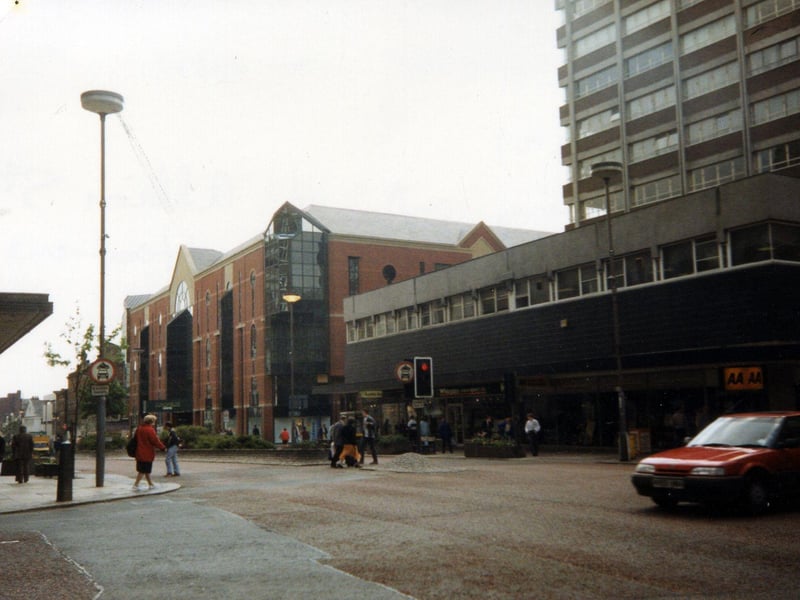 The Headrow from the junction with Albion Street, taken in the spring of 1991. On the right is Cavendish House, with the Automobile Association and Whitegates estate agents, among others, occupying the ground floor. To the left of this, after the junction with King Charles Street, is the Schofields Centre.