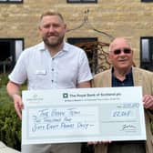 General Manager presents cheque to The Green Team
