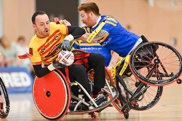 James Simpson makes a tackle during Rhinos' 2022 Wheelchair Challenge Cup Final win over Catalans Dragons. Picture by Will Palmer/SWpix.com.