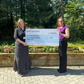 Louise Lawrence hands over the grant cheque.