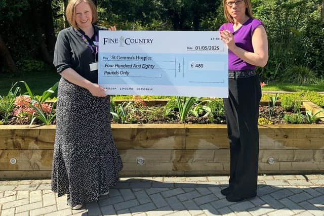 Louise Lawrence hands over the grant cheque.
