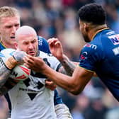 Zak Hardaker is tackled by Mikolaj Oledzki during Hull FC's win against Leeds Rhinos in March. Picture by Allan McKenzie/SWpix.com.