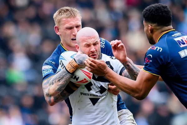 Zak Hardaker is tackled by Mikolaj Oledzki during Hull FC's win against Leeds Rhinos in March. Picture by Allan McKenzie/SWpix.com.