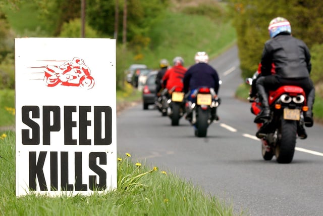 Speed signs are used in the village of Farnley near Otley in May 2003 to try to get motorcyclists to slow down.