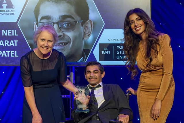 Yorkshire Asian Young Achiever of the Year 2022 Neil Bharat Patel (centre) receiving his award from Professor Karen Bryan, vice-chancellor of York St John University (left), with YAYAs host Noreen Khan (right). Credit: Roger Moody