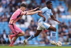 RISING STARS: Leeds United's Charlie Crew goes after Manchester City's Justin Oboavwodou in Friday night's FA Youth Cup final at the Etihad. Photo by Charlotte Tattersall/Getty Images.