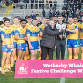 Leeds Rhinos with the Wethertby Whaler Festive Challenge trophy following their win over Wakefield Trinity in the 2024 Boxing Day game. Picture by Tony Johnson.