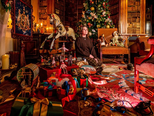 Head of Public Programme at Harewood House Trust, admiring the christmas decorations in the Main Library.