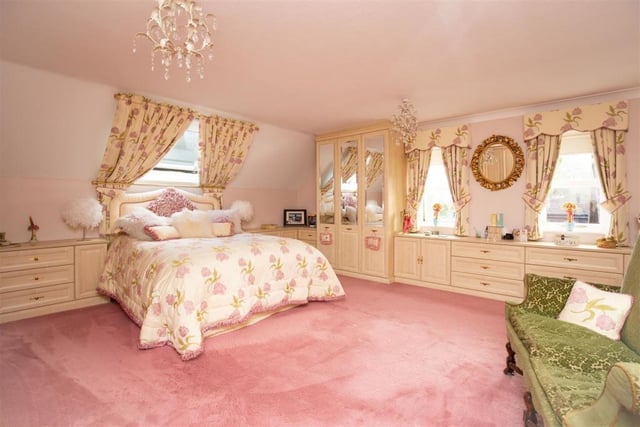 A well-lit double bedroom with fitted wardrobes and furnishing within the house.