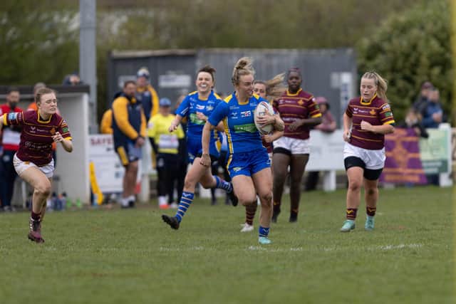 Bethan Dainton tears through Huddersfield Giants' defence during Leeds Rhinos' win in the Betfred Women's Challenge Cup earlier this season. Picture by John Victor.