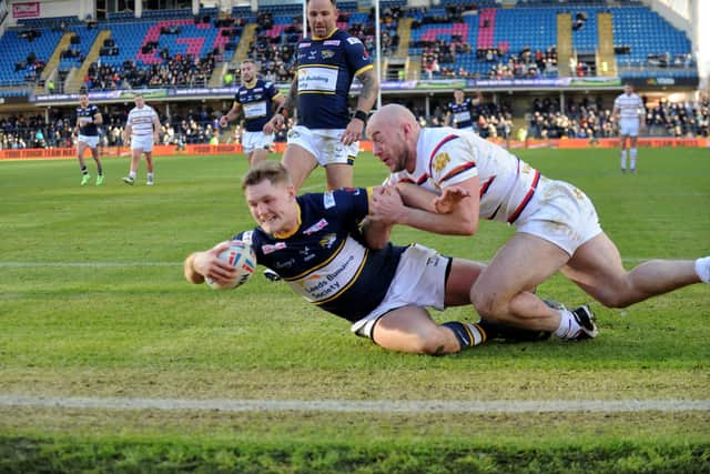 James McDonnell scores for Rhinos in last year's Boxing Day loss to Wakefield. Picture by Steve Riding.