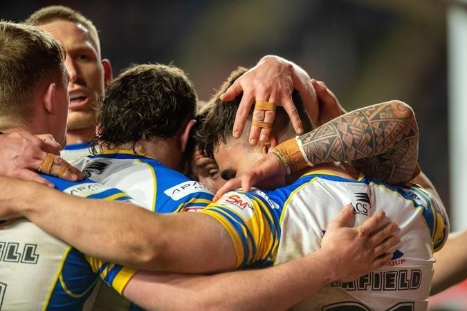 Jack Sinfield is congratularted after scoring a try during his first Super League appearance for Rhinos this season.
