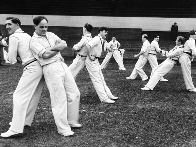 Vic Wilson, skipper Billy Sutcliffe, Cowan, Close, Appleyard and Trueman, with other members of the Yorkshire County cricket team, get some physical training in before the start of practice at the nets at Headingley in April 1957.