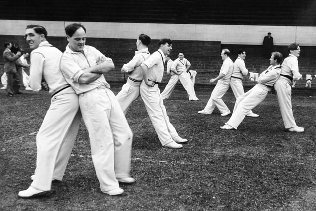 Vic Wilson, skipper Billy Sutcliffe, Cowan, Close, Appleyard and Trueman, with other members of the Yorkshire County cricket team, get some physical training in before the start of practice at the nets at Headingley in  April 1957.