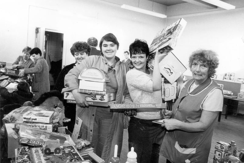 A photo taken at Wykebeck Community Centre in December 1984 during one of two 'Family Allowance' Toy Fairs. The other was held on the same day at the Henry Barran Centre. Local residents in possession of a Family Allowance book were able to buy new and quality second-hand toys as Christmas presents for their children. These were offered at a much cheaper price than in the shops, sometimes between only 10p and 25p. Many toys were donated to the committees and toy wholesalers gave substantial discounts. The Christmas Toy Bonanza was held annually.