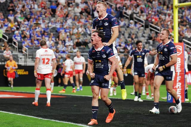 Brodie Croft and Lachie Miller celebrate the former's first try in Leeds Rhinos' 58-6 Las Vegas thrashing of Hull KR. Picture by Alex Whitehead/SWpix.com.