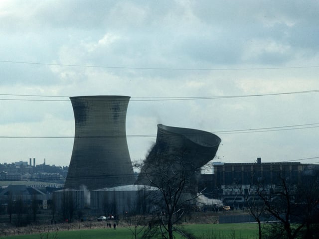 Another view of Kirkstall Power Station taken mid-way through the demolition of the first of two cooling towers in April 1979. The power station had closed in 1976 having been in operation since 1930.