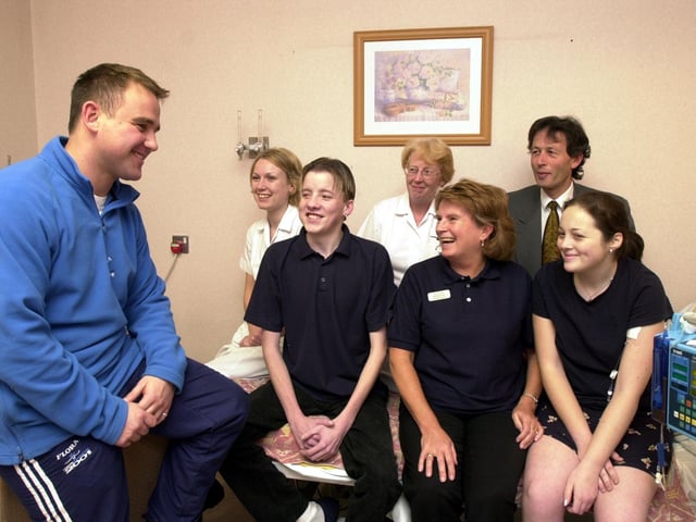 Dave Hancock, the Leeds United physio, returned to his former workplace when he visited the Cystic Fibrosis Unit at Seacroft Hospital to present them with a cheque for £20,000 that he raised running the London Marathon. Dave, left, is pictured with staff nurses, Kellie Priestley and Julie Johnson, Dr Steve Conway and patients Michael Platts and Hayley Mullins, and Anita Watson, support physio, in 2001.