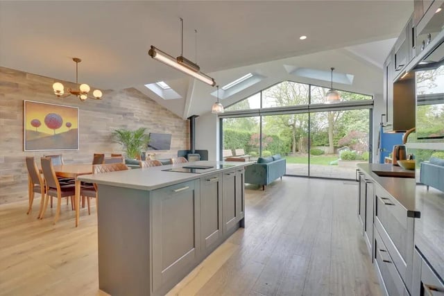 A fabulous family space at the rear of the house with dual aspect windows, the living/dining kitchen has Velux skylights and sliding patio doors out to the garden. It boasts a feature glazed top light above the doors and beautiful oak panelling to one wall.