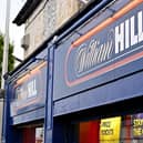 Signage on the front of a William Hill betting shop. It plans to close around 200 betting shops across the UK (Photo: Paul ELLIS / AFP)