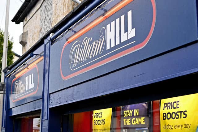 Signage on the front of a William Hill betting shop. It plans to close around 200 betting shops across the UK (Photo: Paul ELLIS / AFP)