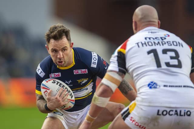 Richie Myler takes on former Rhinos teammate Bodene Thompson during Leeds' win over Bradford last Sunday. Picture by Tony Johnson.