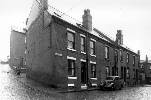 On the left the view is looking up Rothsay Terrace towards Malvern Street. A woman is passing the end of Rothsay View. Four houses are in view on Rothsay Mount. The houses on the right edge are part of Little Town Terrace. Pictured in September 1960.