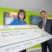 B&DWYW - SGB-37894 - Kinder from Barratt Homes presenting Vickie from Bradford Baby Bank with her cheque