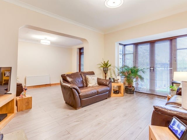 The lounge area is open plan, with doors leading outside.