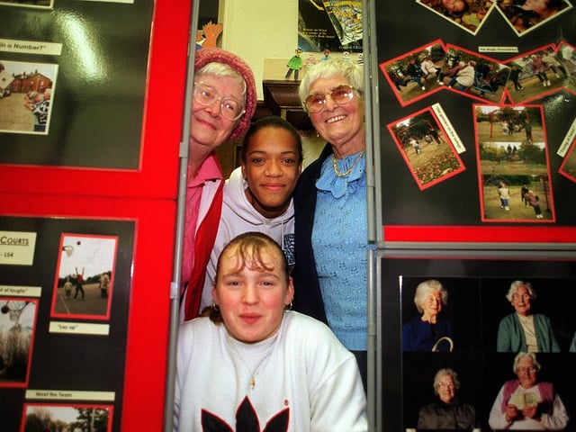 Pictured with a selection of pictures from the Burley photography project displayed in Burley Library in November 1997 are Connie Swabey (top left) and Rosa Hawkins (top right) with Juanita Golding (top middle) and Louise Tallant.