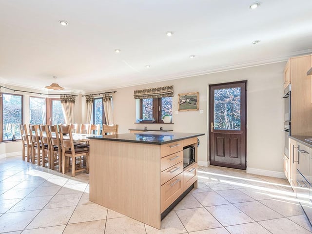 There is plenty of room for a larger style table and chairs in the family dining area, that has a door to the garden.