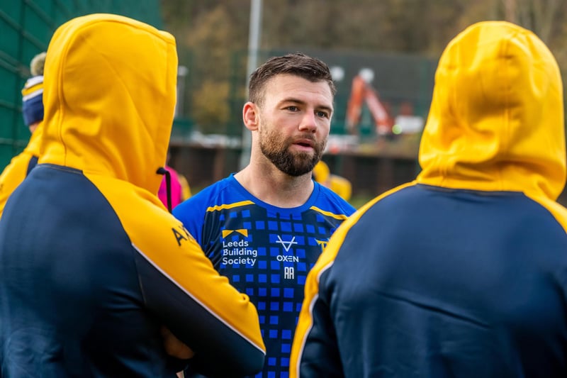 Off-season recruit Andy Ackers chats to two of his new Rhinos teammates.