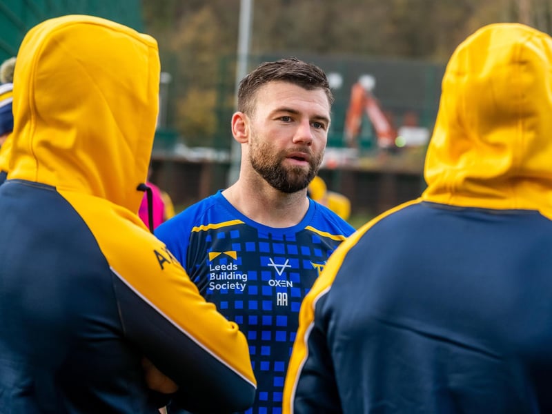 Off-season recruit Andy Ackers chats to two of his new Rhinos teammates.