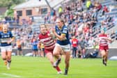 Caitlin Beevers evades Wigan's Vicky Molyneux to score the try which broke the second half deadlock and set Rhinos on course for Wembley.