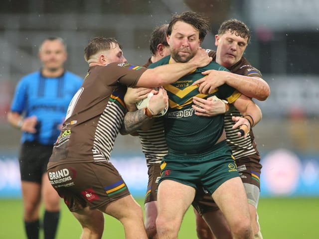 Hunslet ARLFC produced an outstanding defensive display to shut out league leaders West Hull. Here Jaden Barraclough and Jack McShane get to grips with an opponent in driving rain at Wakefield Trinity.
