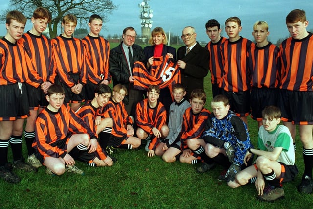 Tinshill Tigers in their new strip provided by local councillors in January 1997 .  Pictured centre, left, is Cookridge councillor Alan Proctor with Gaynor Waite, Tigers secretary and Joe Thoms, chairman of Tinshill Concern.