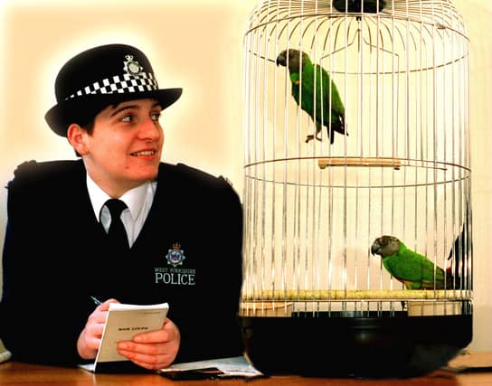 Police officer Sharon Dickinson with two parrots at Pontefract Police Station in February 1996.