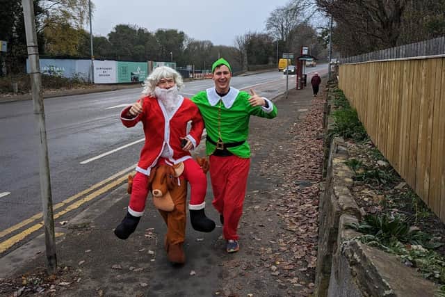 Pete Benefer, dressed as Santa, completed 12 half marathons to raise money for Cash for Kids. His manager, dressed as an elf, joined him on the 12th day.