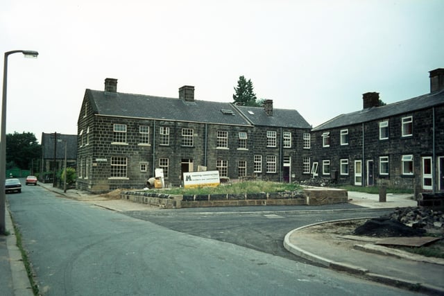Houses on Tannery Square located off Green Road, seen on the left in July 1975. Construction work by Manning Construction is in progress. Tannery Square had been scheduled for demolition as part of the Green Road area slum clearance plan and all the residents were moved out, but instead the houses were saved and given a complete renovation.