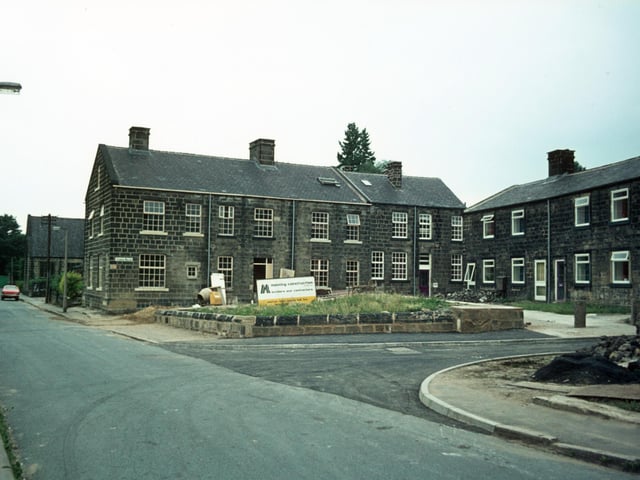Houses on Tannery Square located off Green Road, seen on the left in July 1975. Construction work by Manning Construction is in progress. Tannery Square had been scheduled for demolition as part of the Green Road area slum clearance plan and all the residents were moved out, but instead the houses were saved and given a complete renovation.