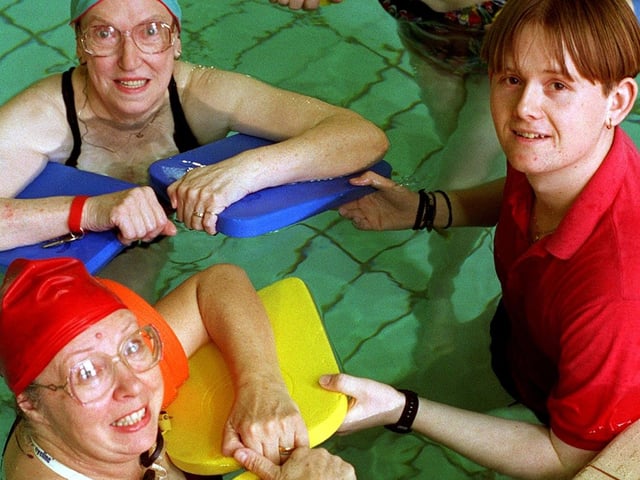 Swimmers Glenys Askey and Molly Clough  at Holt Park Sports Centre with instructor Jason Thornton. They enjoyed free adult swimming lessons in April 1996 as part of the Swimsave campaign.