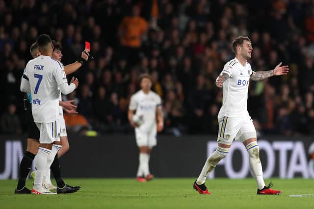 OFF: Leeds United defender Joe Rodon, right, is given his marching orders at Hull City. Photo by Simon Marper/PA Wire.