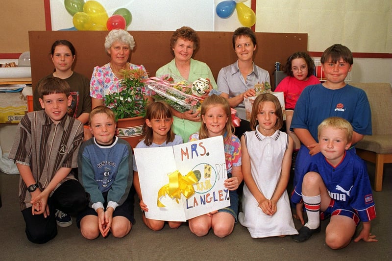 Pupils and staff West Garforth Junior School said farewell to Dorothy Langley (pictured with flowers)in July 1996 who was retiring from the kitchens after 20 years.