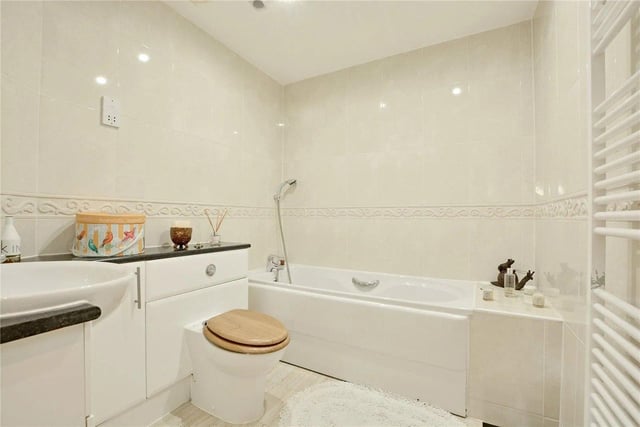 An additional house bathroom is fully fitted with white three-piece suite.